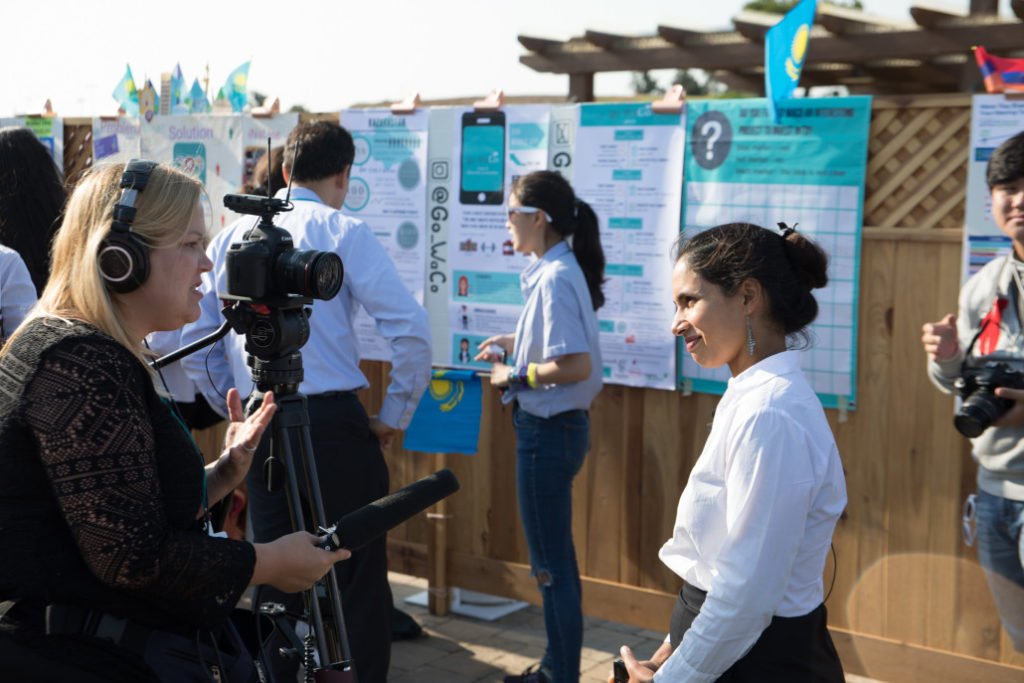Technovation CEO Tara Chklovski outside speaking to a female journalist
