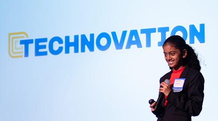 A young girl presents a mobile application she completed as a part of the Technovation Girls program